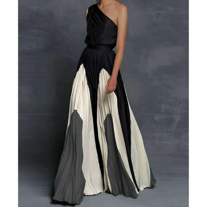 Avondjurk met asymmetrische schouderlijn en plissé rok