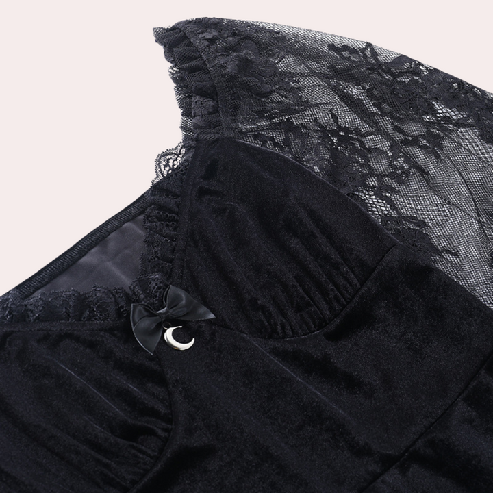 Dames jurk met kanten mouwen en trompetdetails