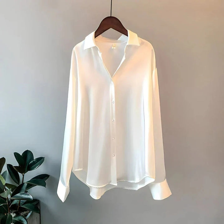 Damesblouse met lange mouwen puntkraag en knoopsluiting