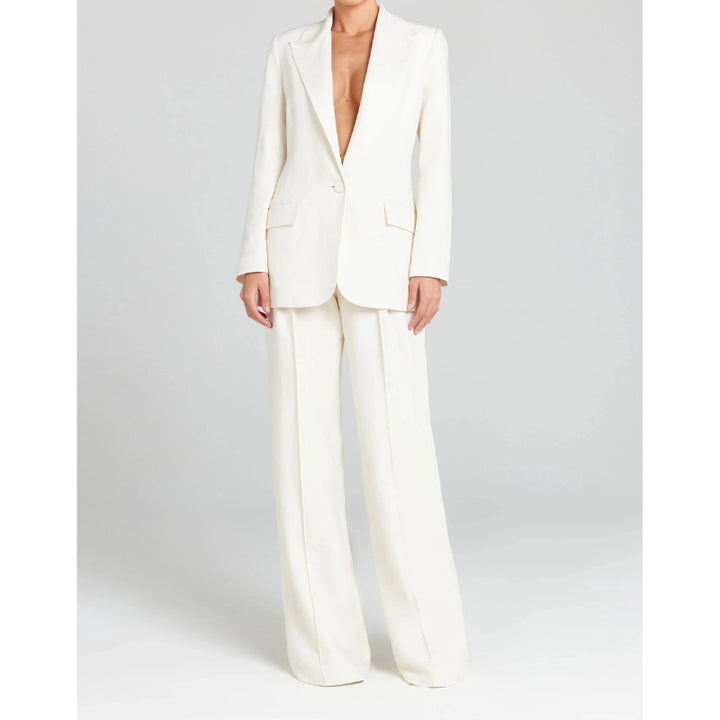 Damespak met enkelvoudige knoopsluiting en wijde pijpen